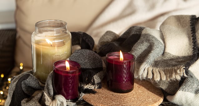 close-up-burning-candles-candlesticks-with-details-home-comfort